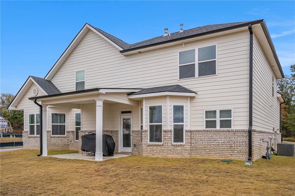 13709 Whitman Lane Covington, GA 30014 - Photo 35 of 36 a view of a white house with large windows