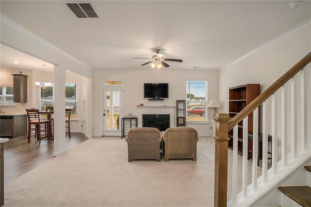 13709 Whitman Lane Covington, GA 30014 - Photo 5 of 36 a living room with furniture and a flat screen tv