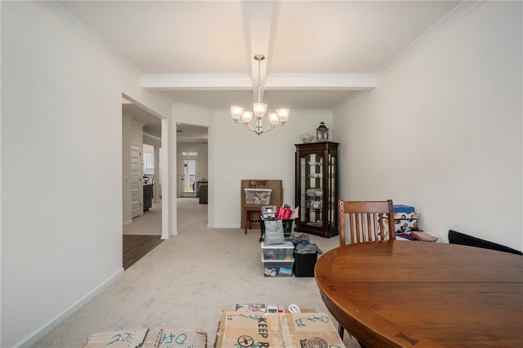 13709 Whitman Lane Covington, GA 30014 - Photo 7 of 36 a bedroom with bed and a chandelier
