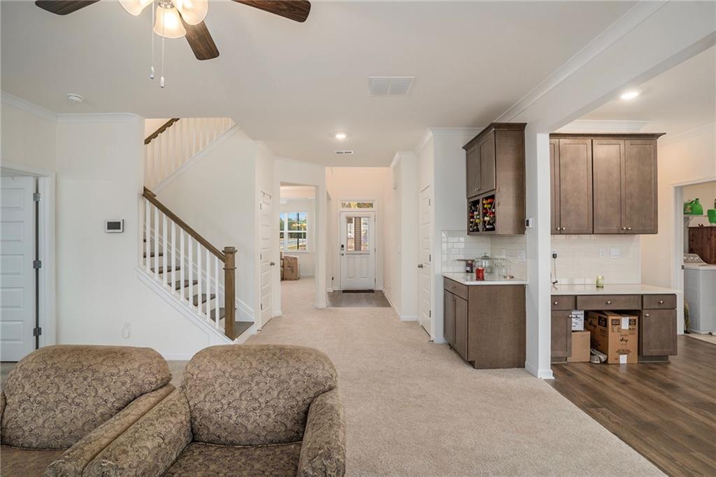 13709 Whitman Lane Covington, GA 30014 - Photo 9 of 36 a living room with furniture and kitchen view