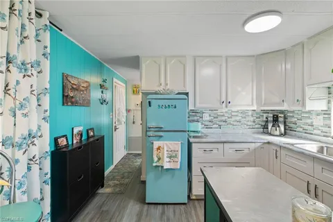 a kitchen with stainless steel appliances granite countertop a granite counter tops and a refrigerator