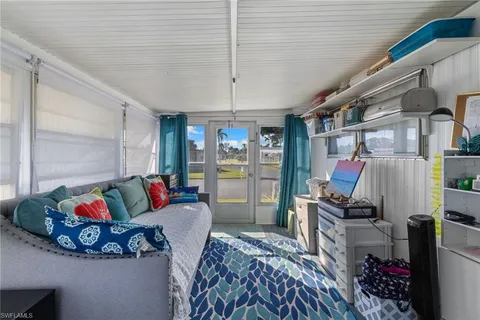 a bedroom with furniture and a chandelier