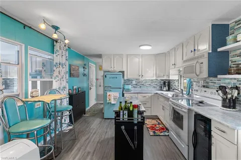 a kitchen with granite countertop lots of counter top space and stainless steel appliances