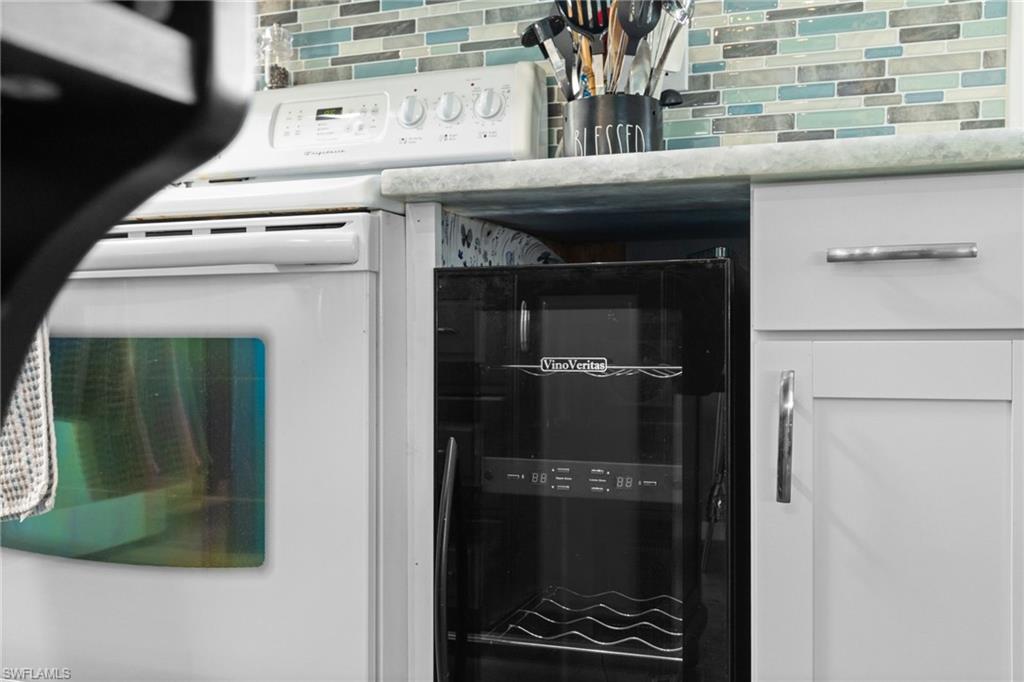 43 Enchanting Boulevard, Unit E43 Naples, FL 34112 - Photo 9 of 36 a close view of a stove top oven and sink