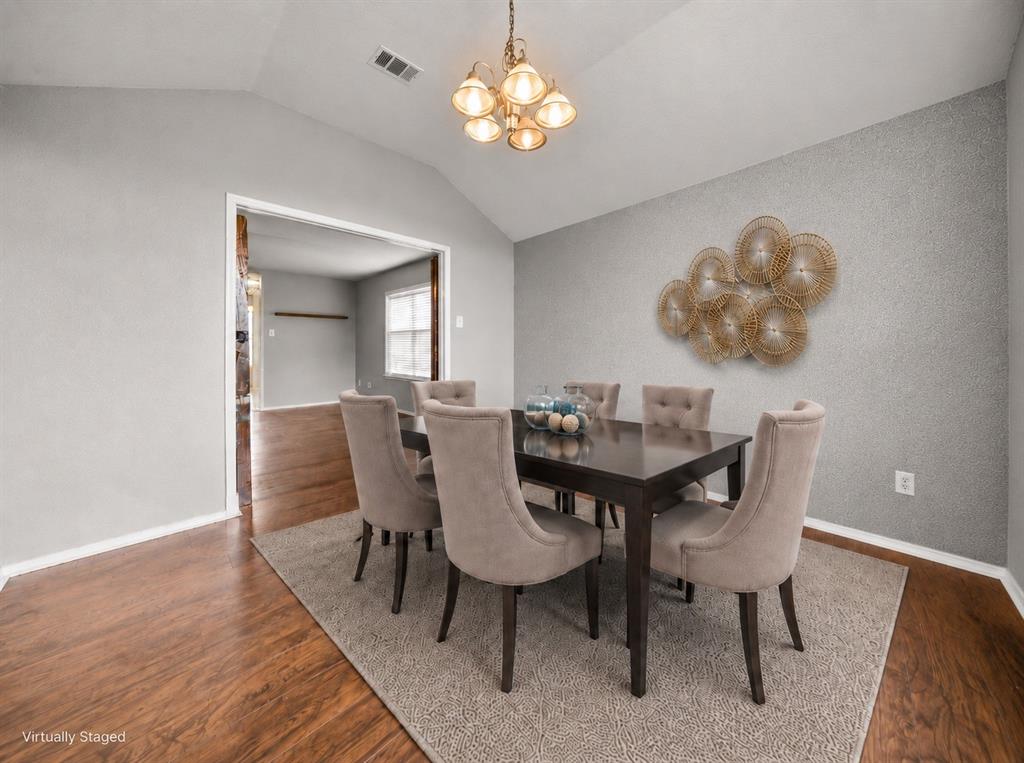 834 Hazel's Way Anna, TX 75409 - Photo 9 of 21 Dining area featuring wood-finish flooring, vaulted ceilings, and a bronze-toned chandelier