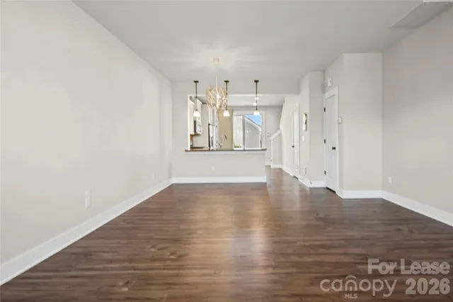 a view of a livingroom with wooden floor