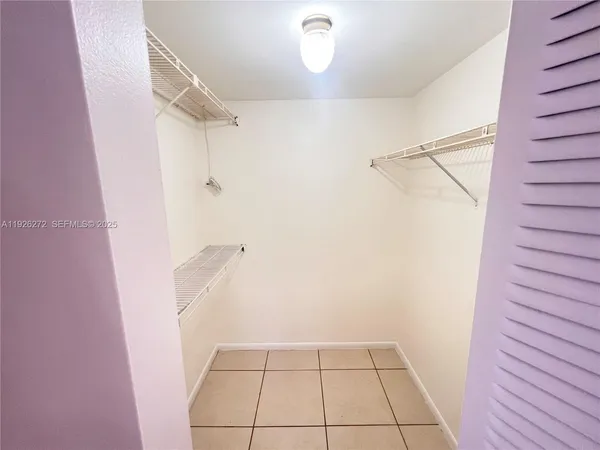 a view of an empty walk in closet