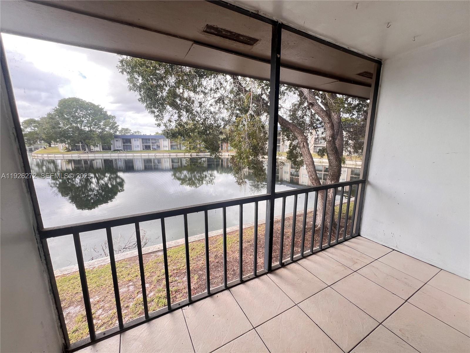 7801 South Colony Circle, Unit 201 Tamarac, FL 33321 - Photo 8 of 10 a view of a porch