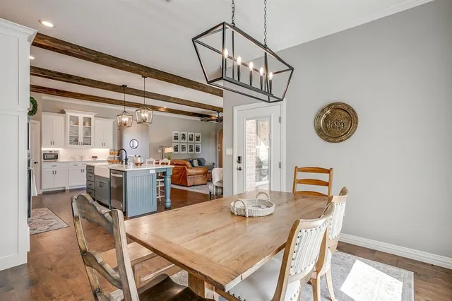 a view of a dining area with furniture and a chandelier