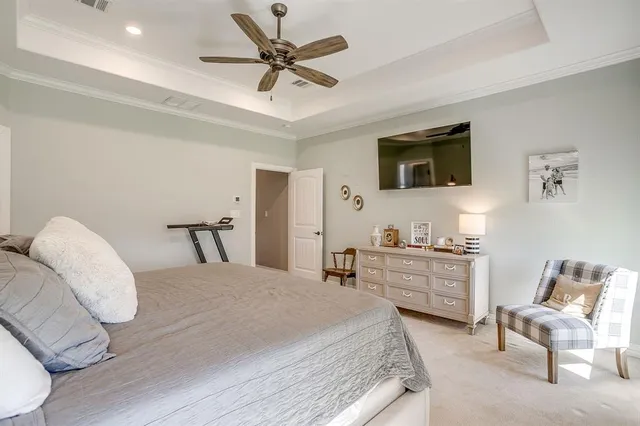 a bedroom with a bed and a chair