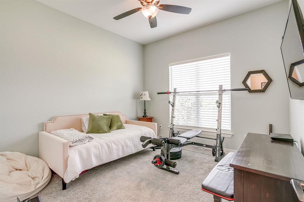 229 Oak Tree Drive Poolville, TX 76487 - Photo 22 of 40 a living room with furniture and a window