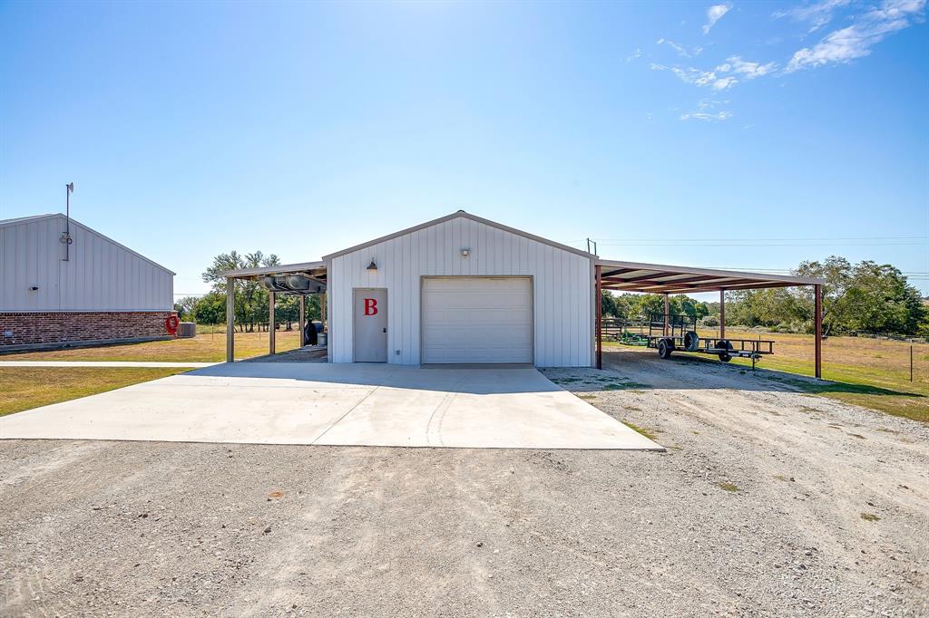 229 Oak Tree Drive Poolville, TX 76487 - Photo 5 of 40 a view of house with swimming pool and yard