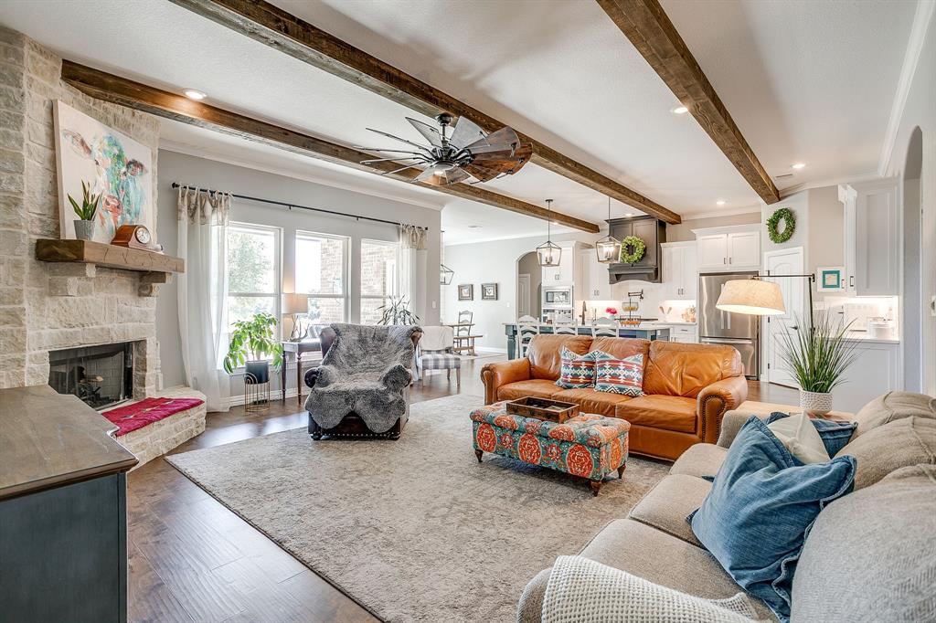 229 Oak Tree Drive Poolville, TX 76487 - Photo 7 of 40 a living room with furniture and a fireplace