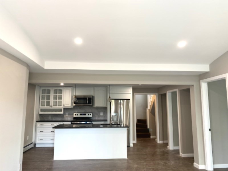 205 West Street, Unit 3 Walpole, MA 02081 - Photo 2 of 12 a view of kitchen with sink and refrigerator