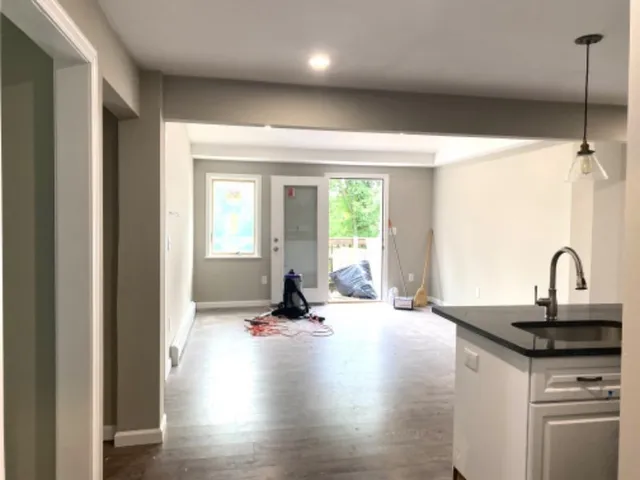 a view of a kitchen with a sink and a window