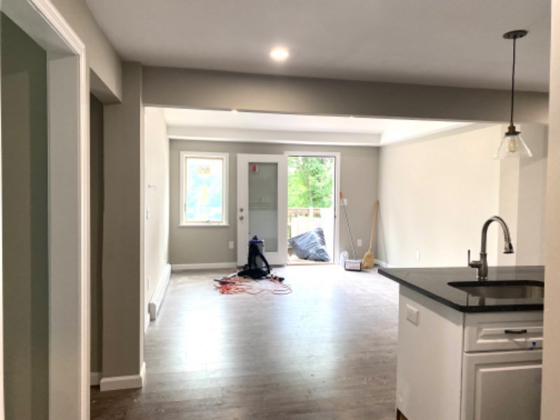 205 West Street, Unit 3 Walpole, MA 02081 - Photo 3 of 12 a view of a kitchen with a sink and a window