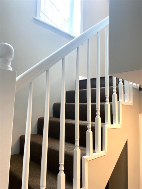 205 West Street, Unit 3 Walpole, MA 02081 - Photo 7 of 12 a view of staircase with white walls and a window
