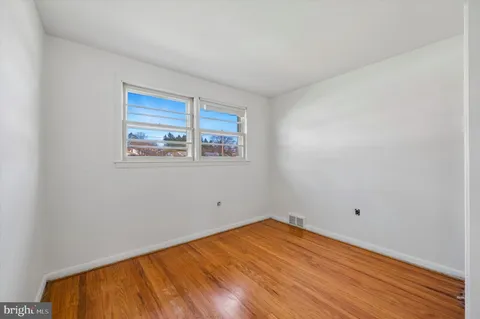 a view of a bathroom from the hallway