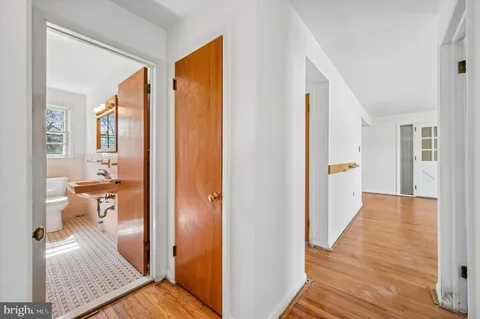 a room with lots of windows and white walls