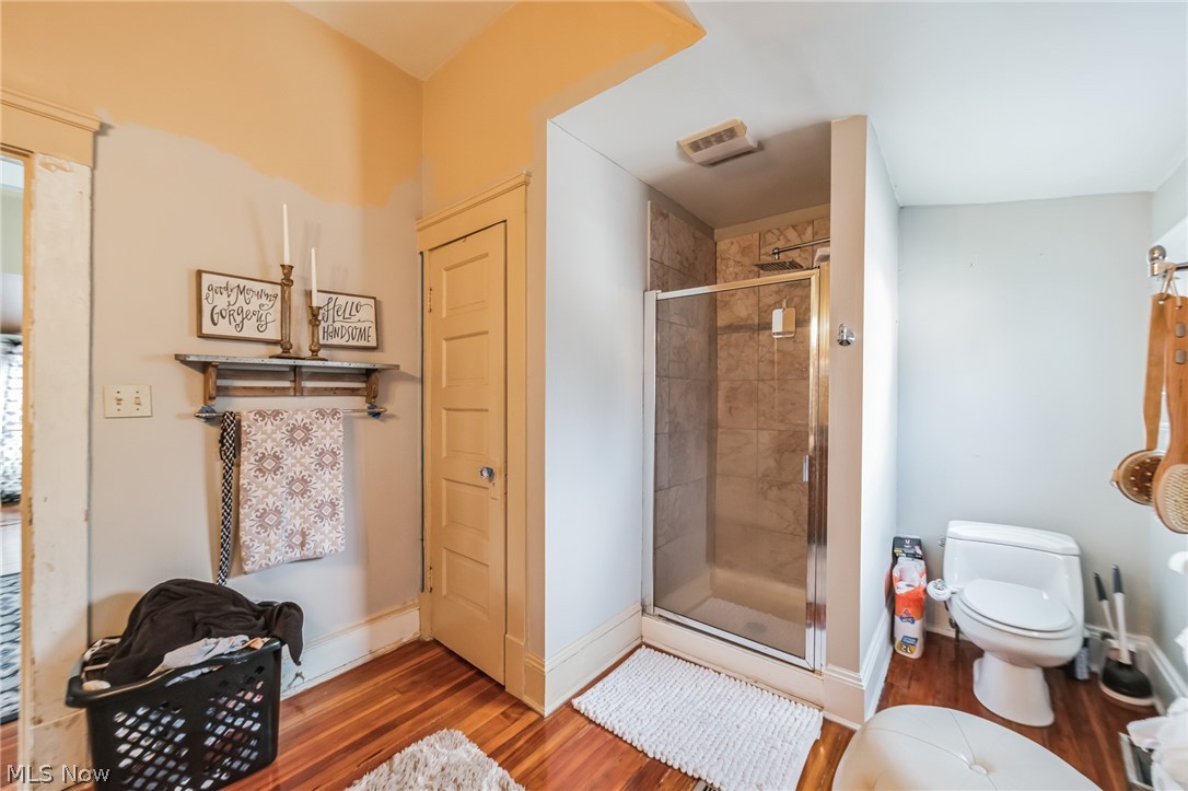 14432 Superior Road Cleveland, OH 44118 - Photo 6 of 24 Bathroom with toilet, hardwood / wood-style flooring, and walk in shower
