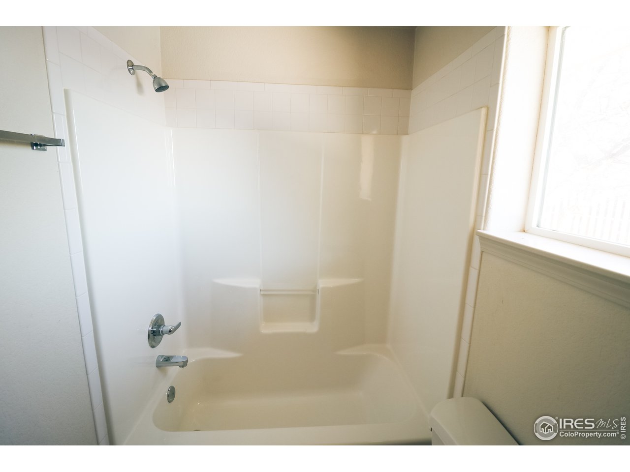 230 South 3rd Street Berthoud, CO 80513 - Photo 13 of 22 a bathroom with a shower