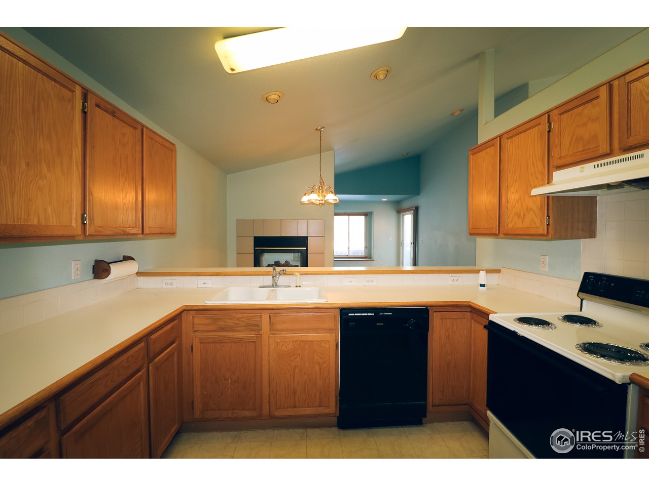 230 South 3rd Street Berthoud, CO 80513 - Photo 8 of 22 a kitchen with a sink and cabinets