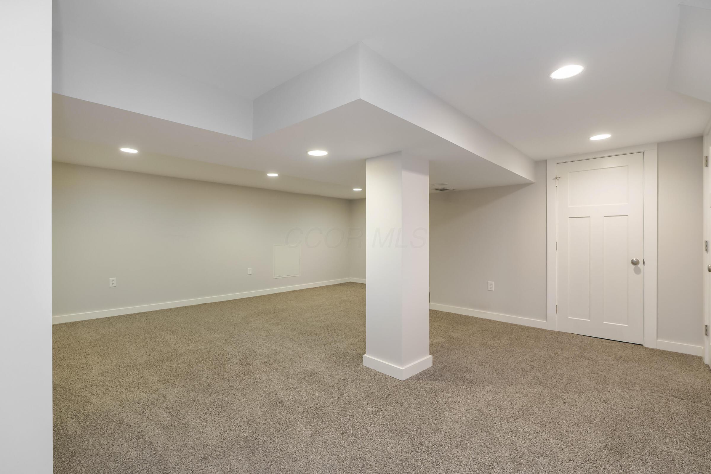 163 Garden Road Columbus, OH 43214 - Photo 23 of 46 Incredible flexible living space in this deluxe finished lower level with a half bathroom.