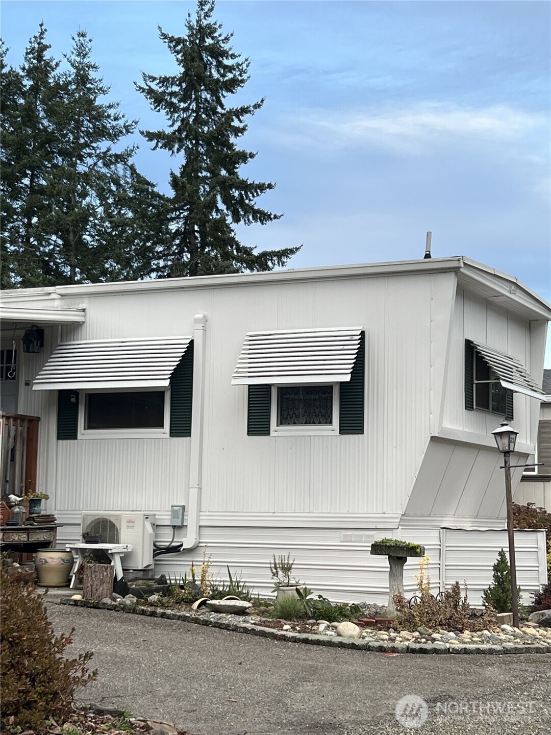 3702 Hunt Street, Unit 23 Gig Harbor, WA 98335 - Photo 1 of 17 a view of a house with backyard