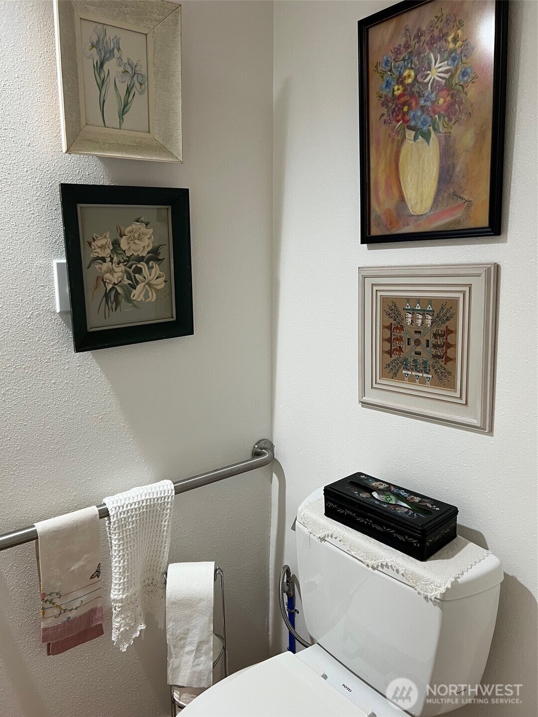 3702 Hunt Street, Unit 23 Gig Harbor, WA 98335 - Photo 12 of 17 a white toilet sitting next to a bathroom sink