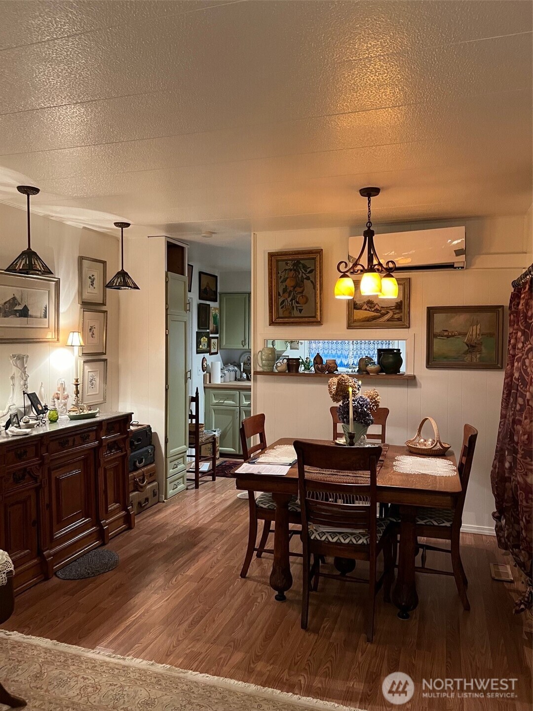 3702 Hunt Street, Unit 23 Gig Harbor, WA 98335 - Photo 4 of 17 a living room with fireplace furniture and a flat screen tv