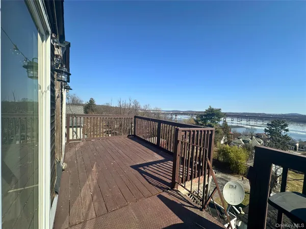a view of balcony with furniture