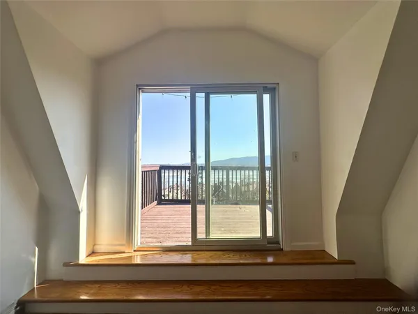 a view of wooden floor and a window