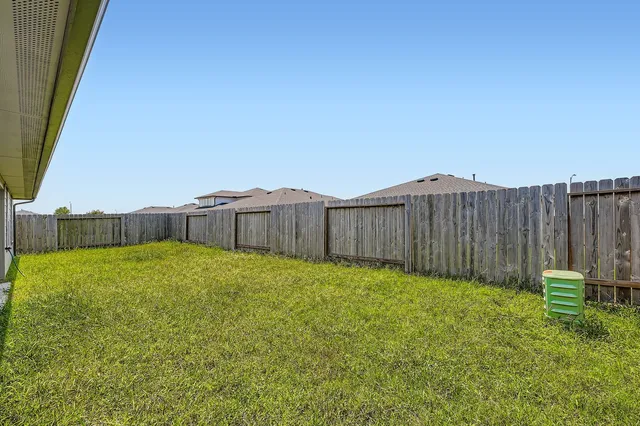 a house view with a backyard space
