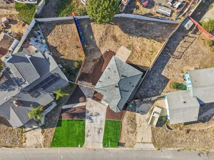 an aerial view of a house with a garden
