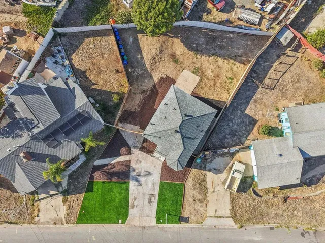 an aerial view of a house with a garden