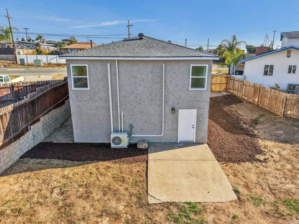 5412 Cervantes Avenue San Diego, CA 92114 - Photo 22 of 28 a front view of a house with a yard