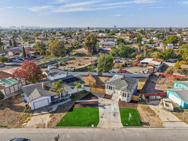 an aerial view of a city with lots of residential buildings