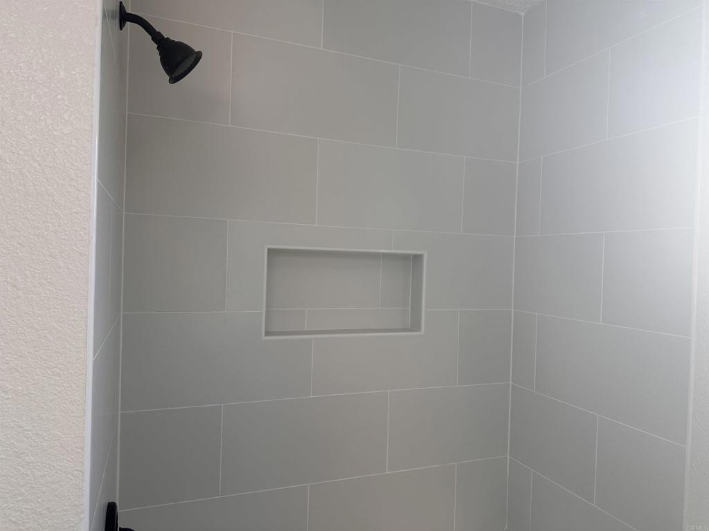 5412 Cervantes Avenue San Diego, CA 92114 - Photo 7 of 28 a bathroom with a shower