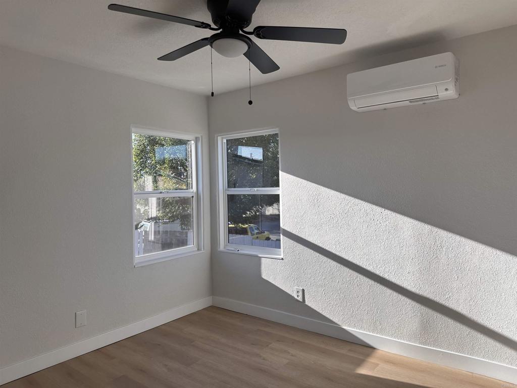 5412 Cervantes Avenue San Diego, CA 92114 - Photo 8 of 28 an empty room with windows and fan