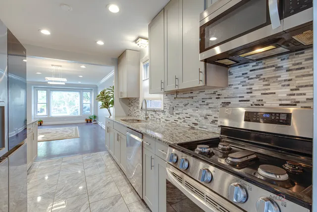 a kitchen with a stove and a sink