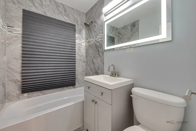 a bathroom with a toilet a sink and a bathtub