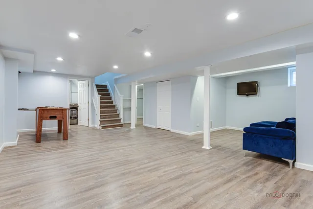 a view of a livingroom with furniture and an empty room