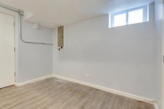 a front view of a house with a garden and yard