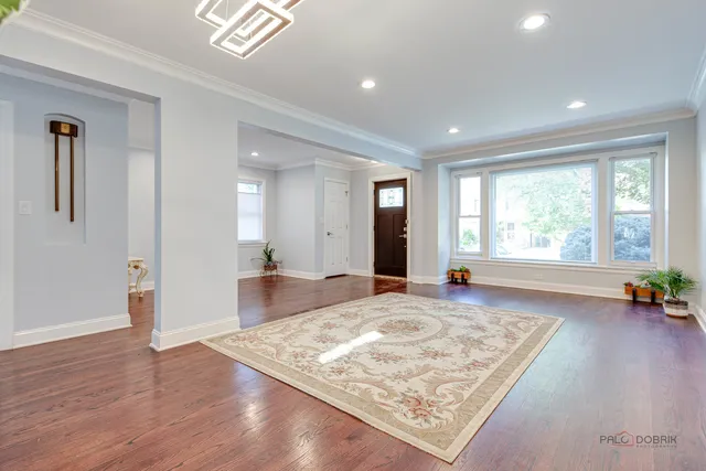 a view of a living room and a rug
