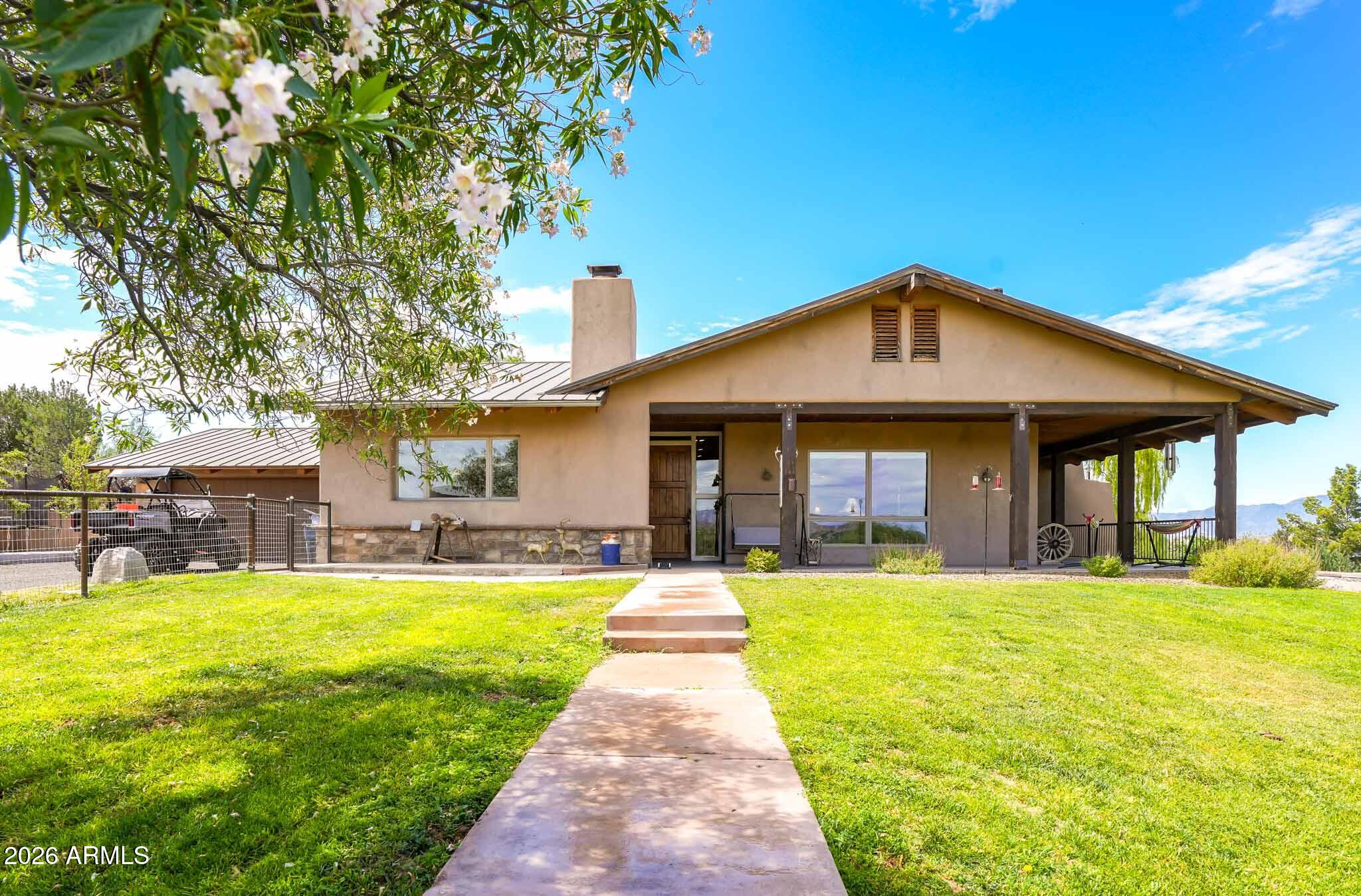 1005 South Page Springs Road Cornville, AZ 86325 - Photo 2 of 43 a front view of a house with swimming pool