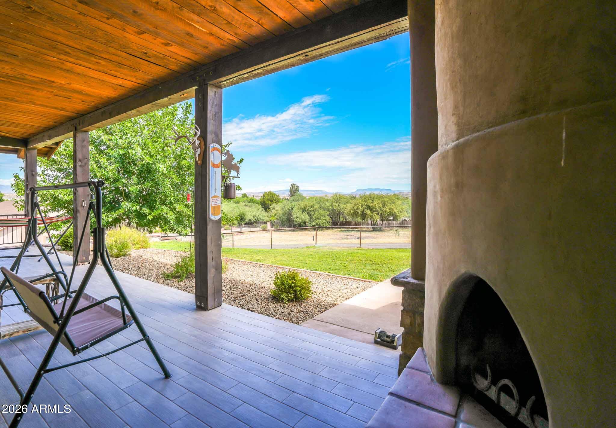 1005 South Page Springs Road Cornville, AZ 86325 - Photo 25 of 43 a view of a floor to ceiling window wooden floor and a yard