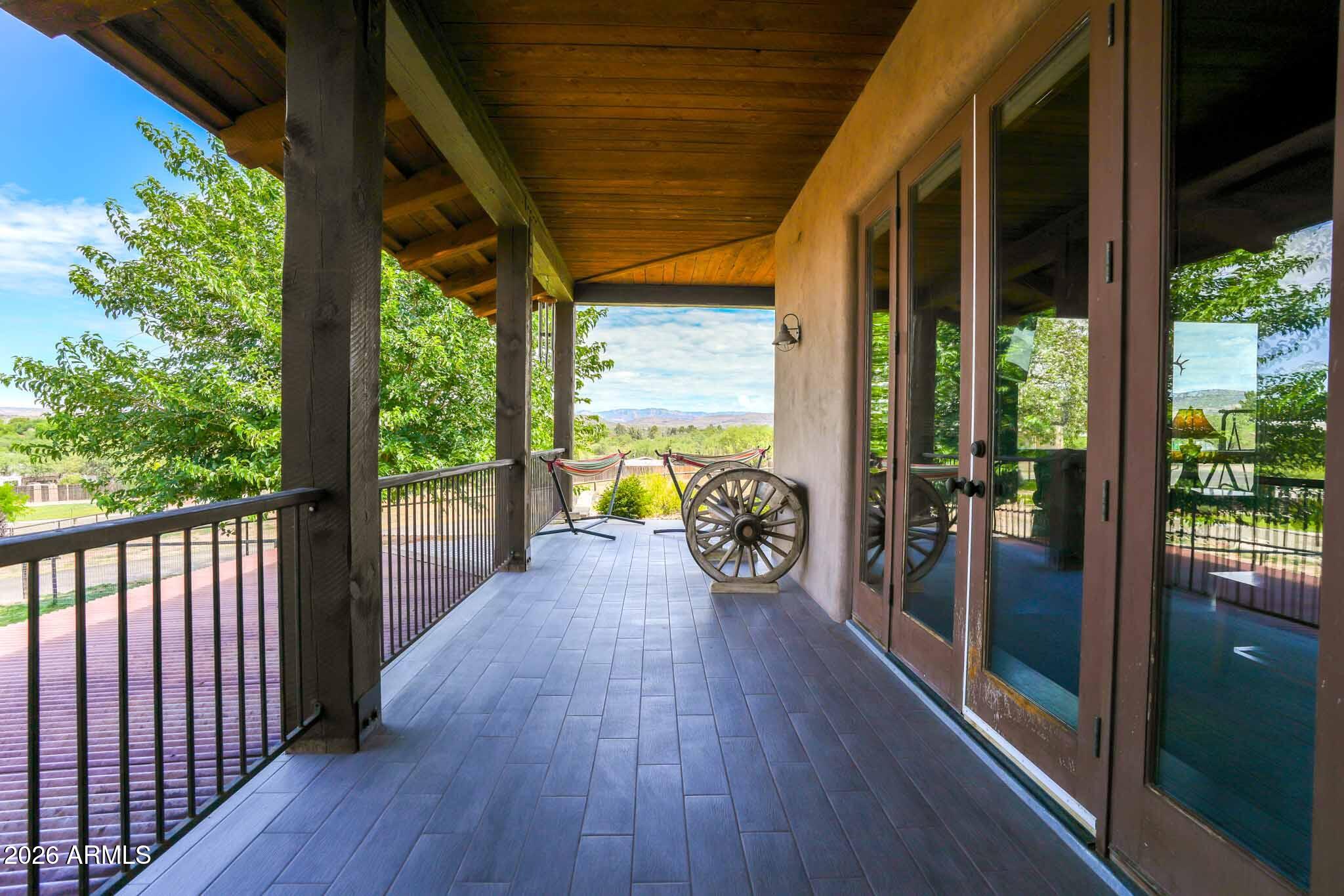 1005 South Page Springs Road Cornville, AZ 86325 - Photo 27 of 43 a view of a balcony with chairs and wooden floor