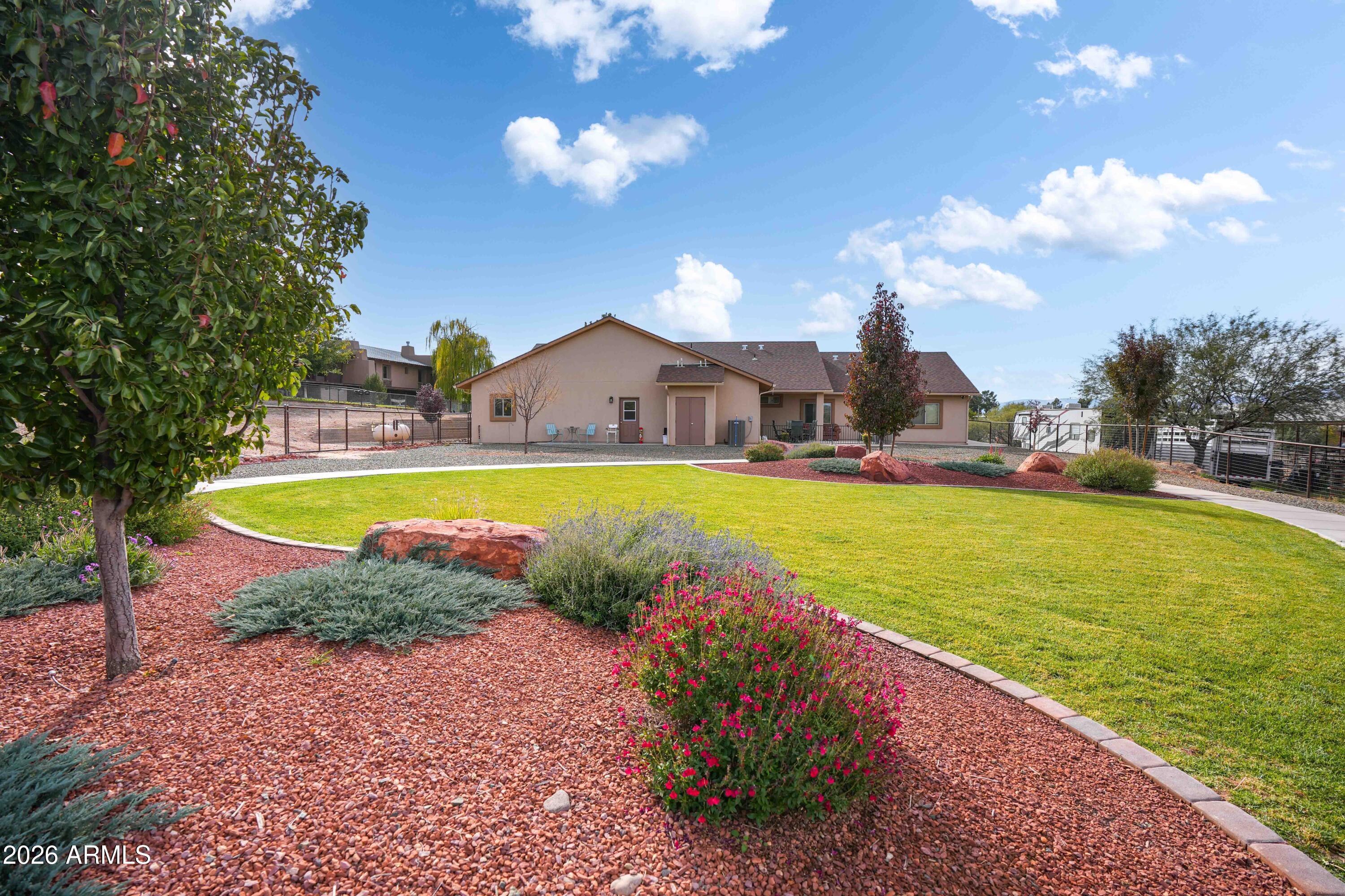 1005 South Page Springs Road Cornville, AZ 86325 - Photo 4 of 43 a view of a house with swimming pool and a yard