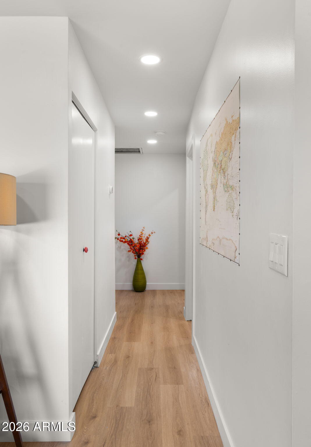 2115 North Normal Avenue Tempe, AZ 85288 - Photo 19 of 38 a view of a hallway to a livingroom with furniture and wooden floor