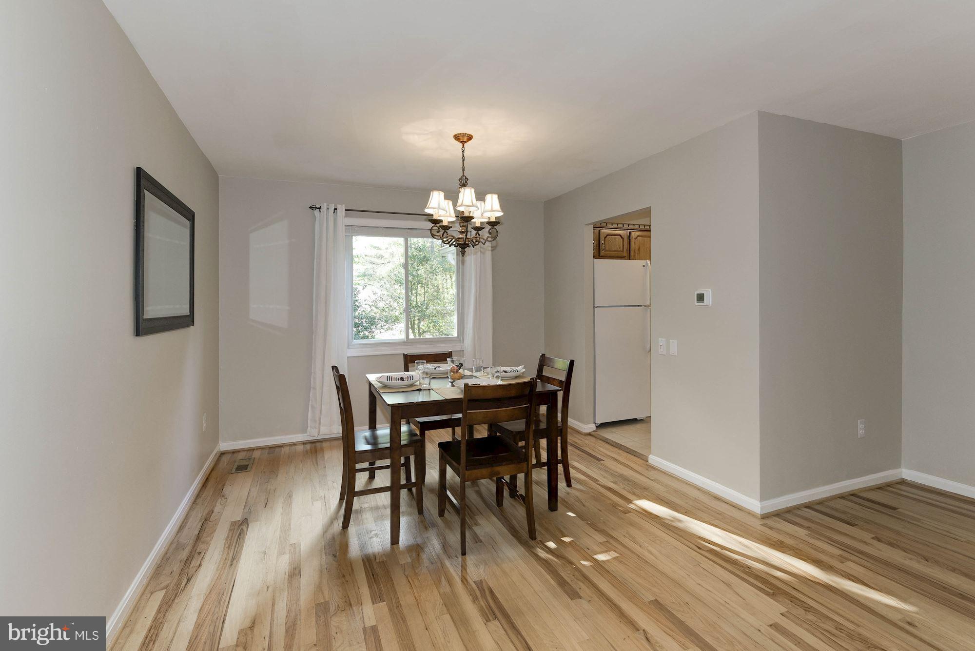 4723 Pickett Road Fairfax, VA 22032 - Photo 3 of 30 Light-filled Formal Dining Room has Kitchen Access